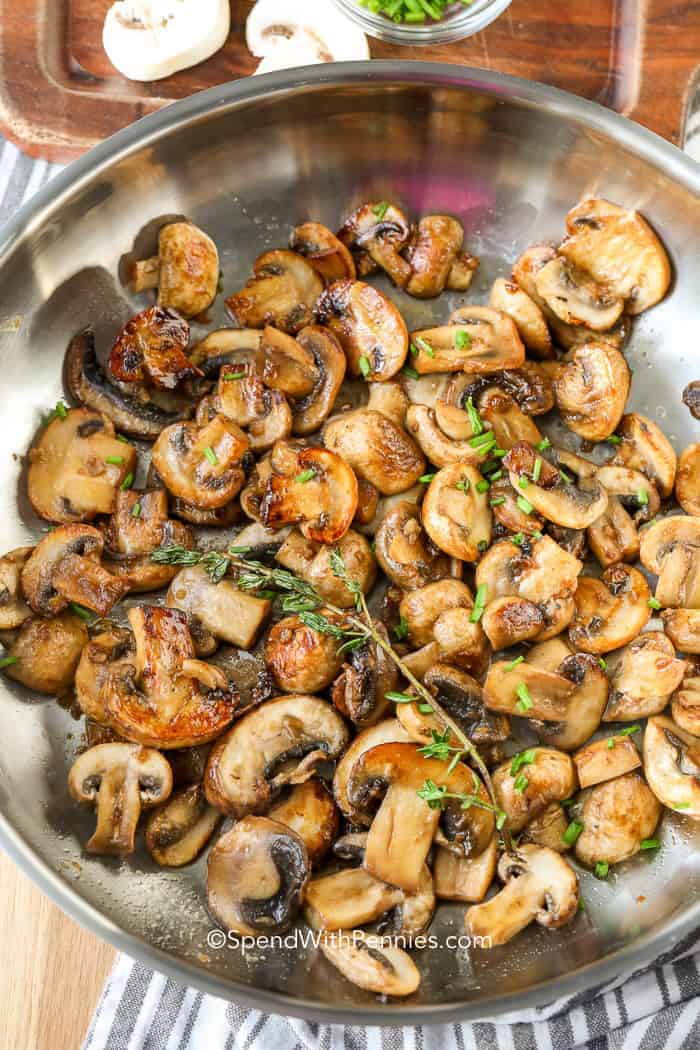 Sautéing mushrooms in a pan